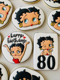 decorated cookies with cartoon characters on them for an 80th birthday party or special occasion