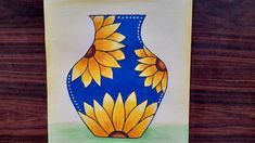 a drawing of a blue and yellow vase with sunflowers painted on the side