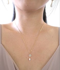 14k gold-filled cz floral petal drop necklace #formalwear #formalnecklace #goldnecklaceset #goldnecklace #pearlnecklace #pearlgoldnecklace #goldpearlnecklace #bridalnecklace #weddingnecklace #jewelry #necklaceoftheday #necklaceshop #necklace #necklacepearl #necklaceforbride #bridenecklace #cubiczirconia #bridesmaidjewelry #bridesmaidnecklace #bridaljewellery #bridaljewelry #weddingjewelry Wedding Necklace With Delicate 14k Gold-filled Chain, Dainty 14k Gold-filled Yellow Gold Pearl Necklace, 14k Gold-filled Pearl Drop Necklace For Wedding, Dainty Gold-plated Yellow Pearl Necklace, Delicate 14k Gold-filled Pearl Pendant Necklace