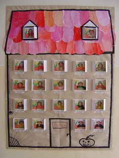 a bulletin board with pictures on it in the shape of a house and two children's faces