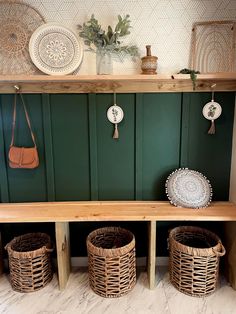 a wooden shelf with baskets and plates on it