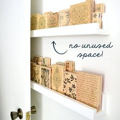 some type of wall hanging on the side of a white door with words above it