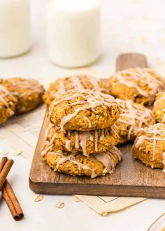 cookies with icing and cinnamon on a cutting board