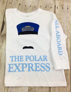 **POLAR EXPRESS GOLDEN TICKET** Polar Express t shirts, kids t shirts Polar Express Christmas t-shirts, family matching shirts matching Christmas shirts, infant ribbed sleeper-(t shirt material) Short sleeve and long sleeve available in t shirts Soft cotton blend 4.5 oz Unisex fit. Machine washable/ tumble dry low Christmas train, polar express, matching family shirts **all sales final** Golden Ticket Polar Express, Polar Express Golden Ticket, Polar Express Games, Xmas T Shirts, Polar Express Pajamas, Polar Express Theme, Polar Express Party, Express Outfits, The Polar Express