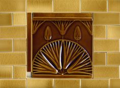 an art deco tile design on the side of a wall