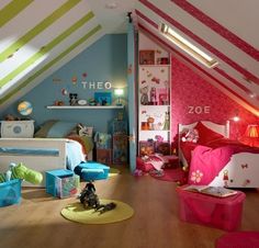 a bedroom with pink, green and blue decor on the walls is pictured in this image