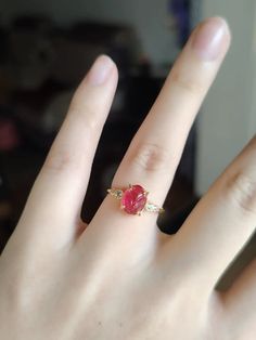 The Rose Petal Whisper Ring captures the delicate beauty of a blooming rose, with a stunning pink gemstone intricately carved to resemble a rose petal at its center. Accentuated by two tiny, sparkling crystals on either side, this ring brings a touch of elegance and subtle sophistication to any ensemble. Its refined gold band enhances the vivid color of the gemstone, creating a harmonious balance between classic and contemporary styles. Perfect for adding a hint of romance and charm to your everyday look or a special occasion. Details Rose Petal Whisper Ring in Red Gold pleated Adjustable opening Missy Jewelry Dragon Breath Collection Natural Stones Necklace, Pearl Jewelry Necklace, Gold Statement Earrings, Natural Stone Bracelets, Blooming Rose, Natural Stone Jewelry, Anklet Bracelet, Pink Gemstones, Sparkling Crystal