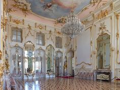 an ornately decorated room with chandeliers and mirrors