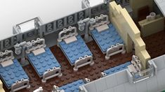 an overhead view of a building made out of legos, with benches and tables