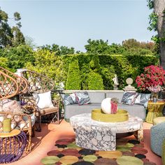 a living room with lots of furniture and flowers