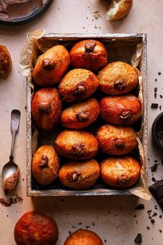 a box filled with baked goods on top of a table next to other food items