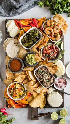 a platter filled with different types of food and condiments on top of it