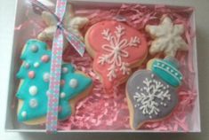 decorated cookies in a gift box for someone's special occasion