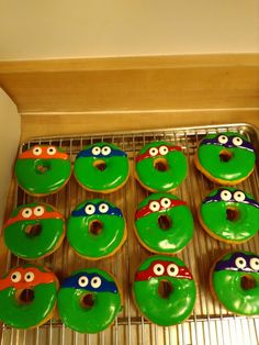 there are many donuts decorated to look like teenaged turtles