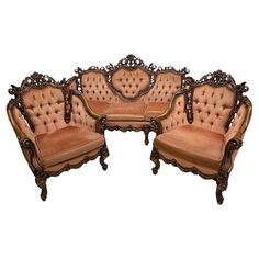 an ornate set of three couches and two chairs