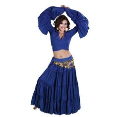 a woman in a blue skirt and top with her hands on her head, posing for the camera