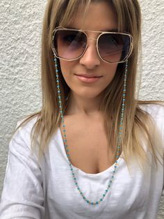 Sunglasses chain from a unique rosary with turquoise beads and gold chain. You can put it in every pair of sunglasses that you wish. In Christina Christi Jewels store you can see a lot of fashion accessories for men and women. You can have them in 2-4 Days with DHL EXPRESS SHIPPING - Rosary Chain with turquoise beads and gold chain that is made from metal. - You can choose in three different dimensions for your glasses. (70 - 80 - 90 cm) # FIND ALL MY DESIGNS IN GLASSES CHAINS HERE: https://etsy Blue Adjustable Chain Glasses Chains For Summer, Blue Adjustable Glasses Chain For Summer, Summer Blue Glasses Chain With Adjustable Feature, Trendy Turquoise Beaded Chain Jewelry, Blue Chain Jewelry For Summer, Bohemian Gold Beaded Glasses Chains, Bohemian Blue Beaded Glasses Chains, Trendy Blue Glass Glasses Chains, Blue Beaded Glasses Chain For Beach