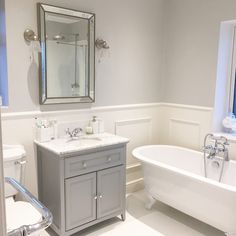 a bathroom with a sink, toilet and bathtub