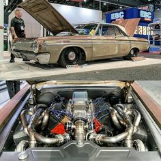 an old car with the hood up and engine in front of it, on display