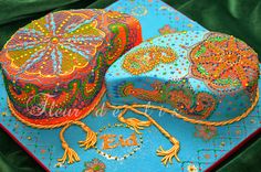 an elaborately decorated cake on a blue plate