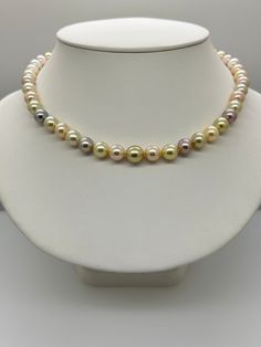 Multi Color South Sea and Freshwater Pearl Necklace.  This stunning one of a kind necklace features 47 Multi Color South Sea and Freshwater Pearls AAA High Luster Round 8.25-10.4 mm Genuine and Natural, white, cream, gold, pink, apricot, lavender all hand knotted with white silk thread and finished with a 14K yellow gold mixed texture round bead clasp 8mm.  The necklace measures 18 1/2 inches in length.   The necklace pictured is the one you will receive. These Pearls are All Genuine and Natural in color, no treatments.  They will come with a wood presentation box and a Certificate of Authenticity.  Please visit our shop for more pearls and gemstone jewelry.  https://www.etsy.com/shop/CertainDesigns Elegant Multicolor High Luster Necklaces, Multicolor High Luster Necklace For Gift, Multicolor High Luster Necklaces As Gift, Elegant Multicolor Single Strand Necklace, Elegant Multicolor Necklace For Anniversary, Elegant Multicolor Single Strand Pearl Necklace, Elegant Multicolor Pearl Necklace For Formal Occasions, Cream Single Strand Round Jewelry, Multicolor Single Strand Round Pearl Necklace