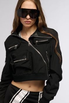 Utility Cropped Jacket For Fall Streetwear, Fall Utility Cropped Jacket For Streetwear, Edgy Stretch Outerwear For Spring, Fitted Biker Jacket With Zip Cuffs For Spring, Trendy Fitted Cropped Jacket For Streetwear, Trendy Stretch Outerwear With Zipper Closure, Edgy Cropped Jacket With Zipper And Long Sleeves, Edgy Cropped Jacket With Zipper Closure, Edgy Cropped Jacket With Zipper Closure And Long Sleeves