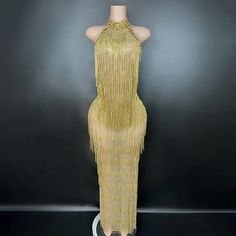 Stunning gold rhinestone fringe embellished halter maxi dress. If you're looking for that sparkly, bling statement piece, you have found it! Made to order - Please allow 4-6 weeks for production  * Sizing - All items are made according to measurement ranges, they are NOT typical letter or numeric sizing. It is imperative to compare your exact measurements with the size chart provided either in the listing photos or item descriptions and to also add your measurements under Personalization. If you Cocktail Dress Classy, Feather Jacket, Feather Tops, Rhinestone Fringe, Rhinestone Chain, Halter Maxi Dress, Ladies Gown, Rhinestone Dress, Halter Maxi