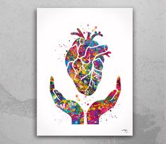 two hands holding a colorful heart with watercolor paint splatters on the background