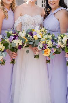 the bride and her bridesmaids are holding their bouquets