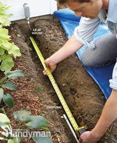 a man is measuring the soil in his garden