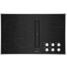 an electric cooktop with four burners and knobs