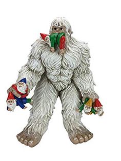 a figurine of a bigfoot with gnomes