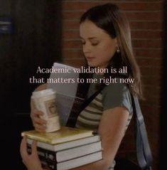 a woman holding a stack of books in her hands with the caption's quote on it