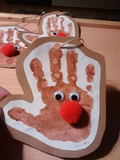 two handprints that have been made to look like rudolph the reindeer