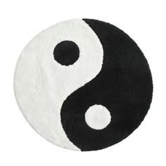 a black and white rug with a yin symbol on it