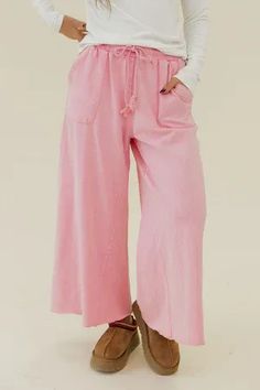 Upgrade your everyday look with our Maren Pants in Barbie Pink. The wide leg design and elastic waist with tie provide both comfort and style. Made from a faded washed material, these pants also feature front pockets for added convenience. Perfect for those who value both fashion and functionality in their wardrobe. Leg Design, Everyday Look