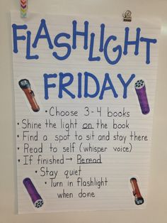 a sign that says flashlight friday on the front of a white board with blue writing