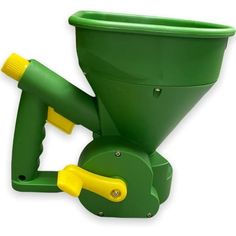 a green machine with yellow handles on it's head and nozzles attached to the handle