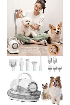 a woman sitting on the floor with two dogs and hair dryers in front of her