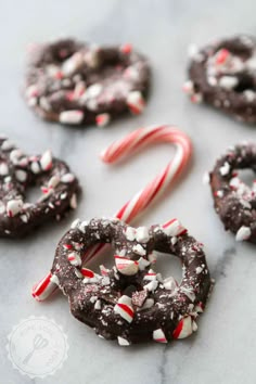 chocolate covered pretzels and candy canes on a table