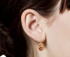 With a warm toned, feminine color and easy-to-wear design, these Polly Wales earrings are a modern, edgy alternative to the traditional gem dangle. Mixed cut pink sapphires varying in color from pale rose to deep magenta are cast directly in to the 18K yellow gold oval along with round, white diamonds. The drops hang from 18K yellow gold ear wires. total length : 7/8"18K yellow gold and pink sapphire oval : 1/2" x 3/8"pink sapphires : vary : 1.5mm diameter to 4mm x 2mm each : ~.89cttwdiamonds : Pink Teardrop Earrings With Prong Setting, Pink Oval Ruby Earrings, Pink Fusion Style Formal Earrings, Polly Wales Jewelry, Jewelry Facts, Daniela Villegas, Alice Cicolini, Twist Jewelry, Deep Magenta