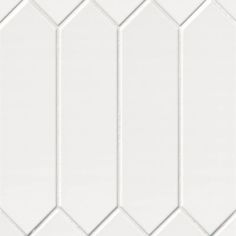 white hexagonal tiles are arranged in an angled pattern, with one diagonal line at the center