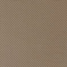 a brown background with white polka dots