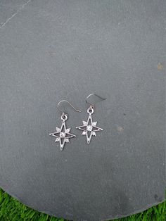 PLEASE read my shop announcement before placing an order so you know what to expect right now. Plus, when ordering from outside Europe, don't forget to provide a phone number for the courier to ensure the fastest and smoothest delivery. Elegant dangle rhinestone starburst earrings, comfortable and lightweight Stainless steel earhooks Stainless steel hooks, won't rust, change its tone or cause you any allergies More Magical celestial jewelry here: https://www.etsy.com/shop/ValkyriesSong?ref=selle Celestial Silver Earrings With Star Charm, Star Charm Metal Drop Earrings, Metal Star Charm Drop Earrings, Silver Star Charm Crystal Earrings For Gift, Single Star-shaped Crystal Earring As Gift, Pierced Star-shaped Metal Jewelry, Pierced Metal Star Jewelry, Metal Star-shaped Jewelry, Silver Celestial Crystal Earrings As Gift