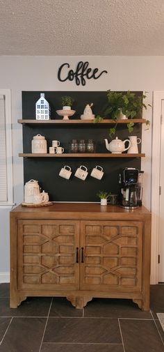 a coffee bar with shelves and cups on it