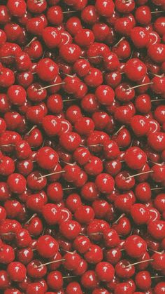 a pile of cherries sitting on top of each other