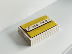 a stack of business cards with the words lucas garage on them