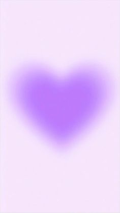 a purple heart shaped object is shown in the middle of a white background with an overexposed image