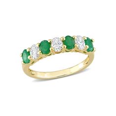 an emerald and diamond five stone ring