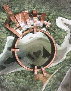 an aerial view of a circular building surrounded by trees